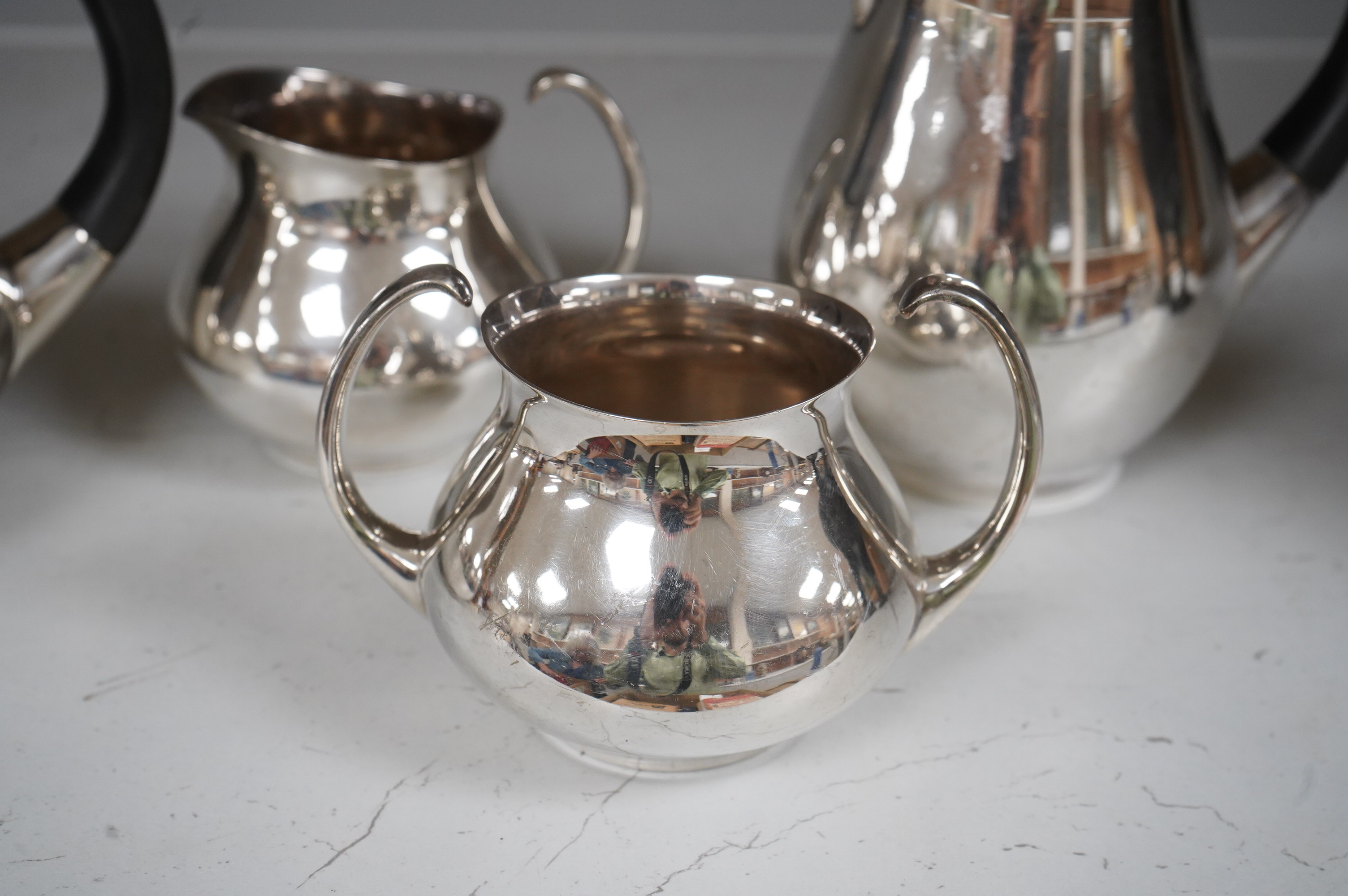 Eric Clements (1925-2019) a four piece plated tea set, c.1960, Embassy plate by M&W England, water jug and cover, 19.5cm high